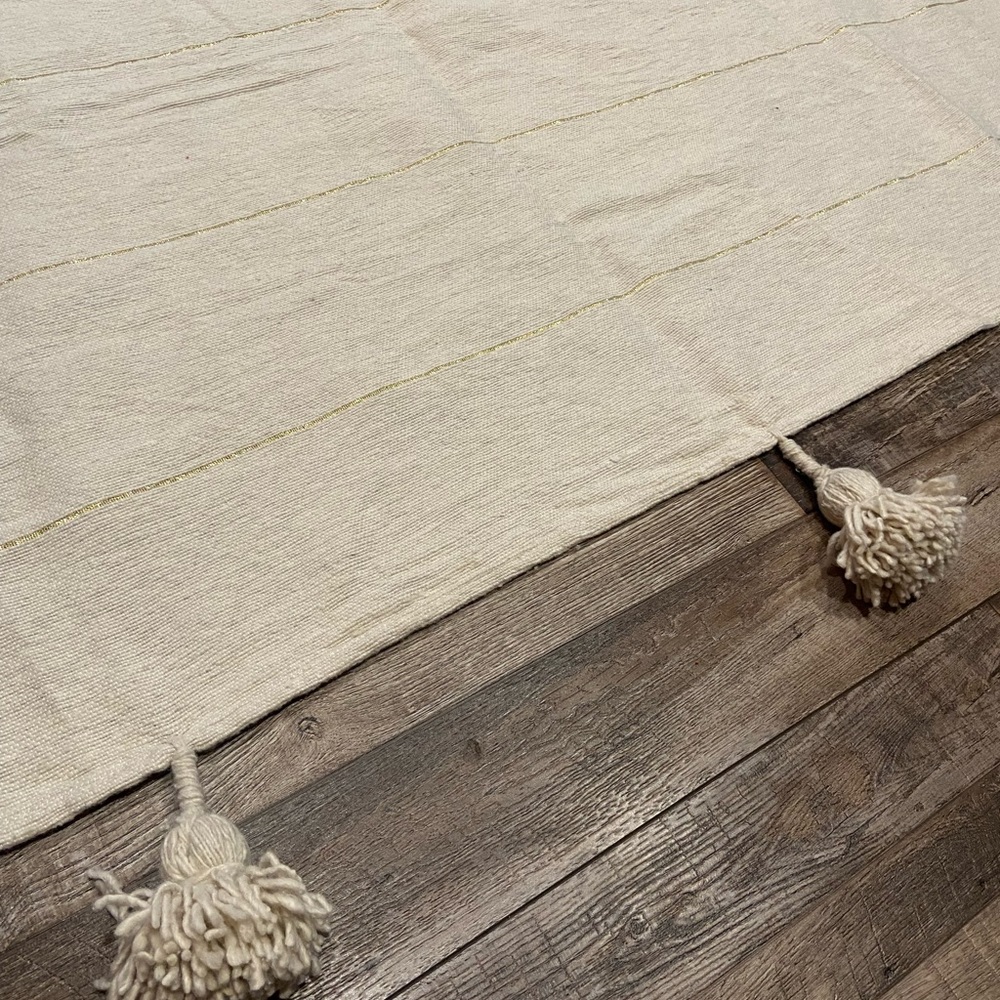 72”x61” Light Weight Beige w/ Gold Stripe Floor Covering with Tassels.